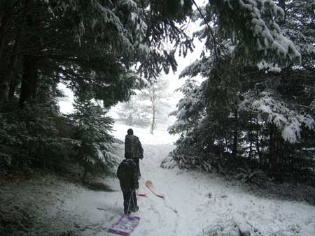 Jake and Rob trek back up the hill for another ride down.
