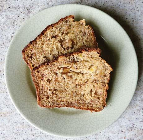 Freshly made loaf of round bread in the black cast iron oven pan