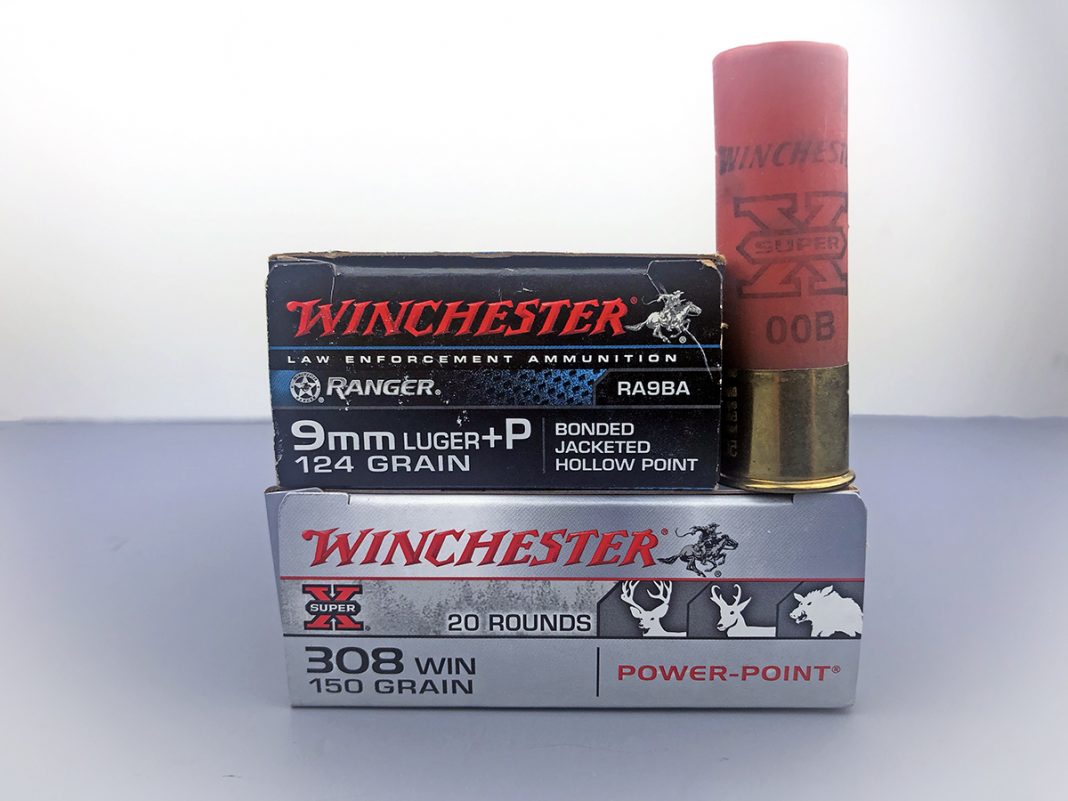 a box of rifle ammo, a box of pistol ammo and a shotgun shell