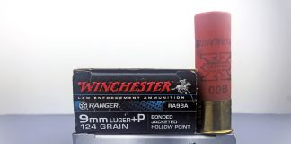 a box of rifle ammo, a box of pistol ammo and a shotgun shell