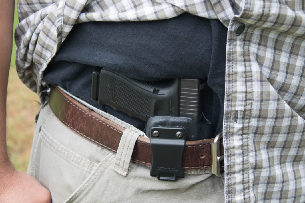 A Glock Handgun in an appendix holster